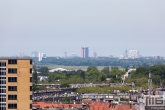 De skyline van Delft vanuit Rotterdam tijdens de Rotterdamse Dakendagen