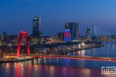 Te Koop | De skyline van Rotterdam by Night met de Willemsbrug en de Wilhelminapier