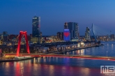 Te Koop | De skyline van Rotterdam by Night met de Willemsbrug en de Wilhelminapier