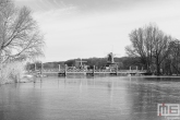 Te Koop | Sneeuw bij de Kralingse Plas in Rotterdam met de molens De Ster en De Lelie.