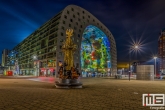 Te Koop | De Markthal in Rotterdam met op de voorgrond het Marten Toonder Monument