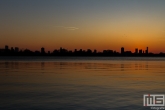 Te Koop | De skyline van Rotterdam vanaf de Kralingseplas in Rotterdam tijdens zonsondergang